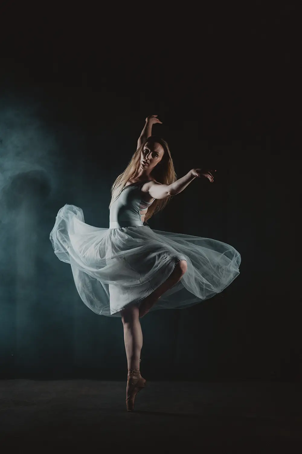 A white-clad dancer twirls