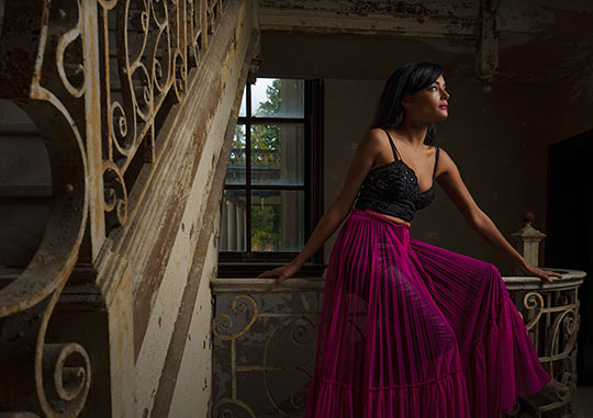 Model poses inside abandoned building